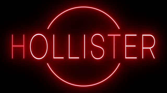 Glowing and blinking red retro neon sign for HOLLISTER, city in California