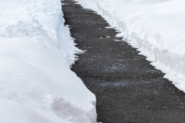 istock Road with salt for melting snow in winter. 1949093611