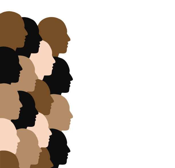 istock Overlapping cutout human heads in different colors, looking towards your copy space 1949101774