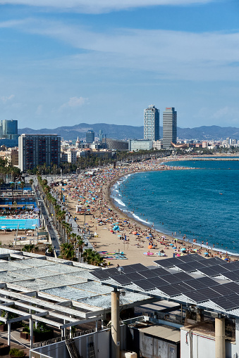 Barceloneta beach with the two towers of the Olympic Port in the background