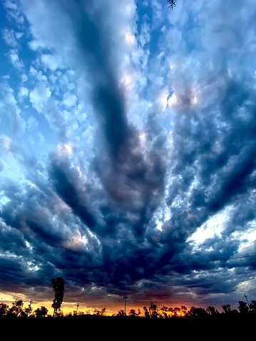Clouds explode over sunset in the outback