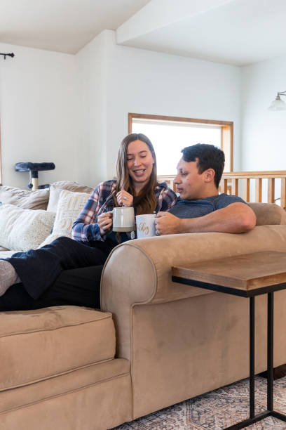 istock Multi Racial Couple Relaxing at Home Together 1949127672