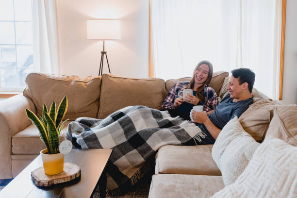 istock Multi Racial Couple Relaxing at Home Together 1949127705