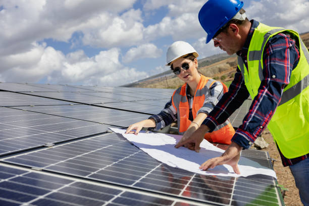 Free Stock Photo of Engineers consult on solar panel installation ...
