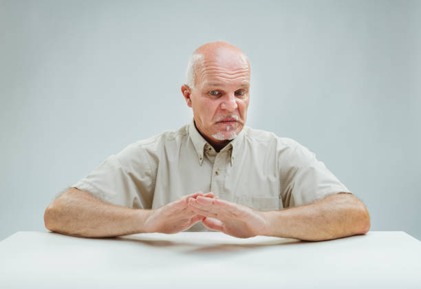 istock Man disturbed, crossed hands signal deep displeasure 1949140291