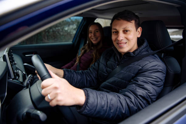 istock Young Couple Road Trip by Car 1949157625