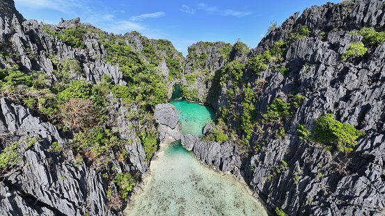 Small Lagoon - El Nido Philippines Palawan Island - El Nido - famous Small Lagoon on Miniloc Island - Bacuit Bay. Aerial Drone Point of View towards the famous Small Lagoon at the coast of  Miniloc Island. Miniloc Island, Mimaropa, El Nido, Palawan, Philippines, Southeast Asia, Asia