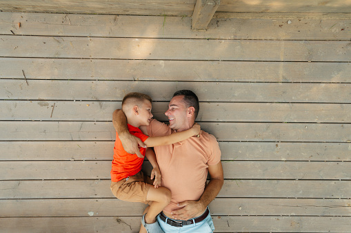 Photo of a father and son having a good time together.