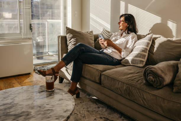istock Woman chatting on mobile 1949203812