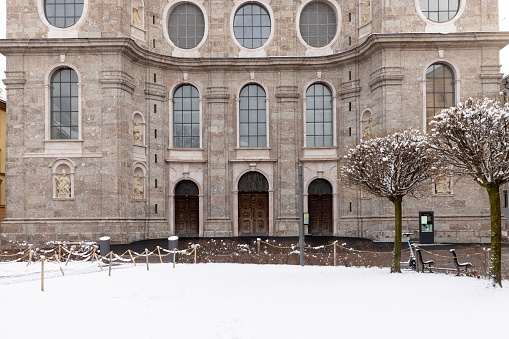 Innsbruck, Austria - February 26, 2023: Facade of Innsbruck Cathedral located on Cathedral Square (Domplatz)