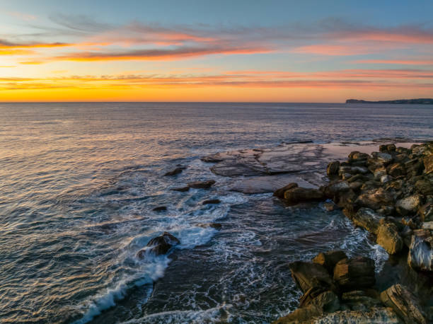 istock Sunrise at the seaside with high cloud 1949211003