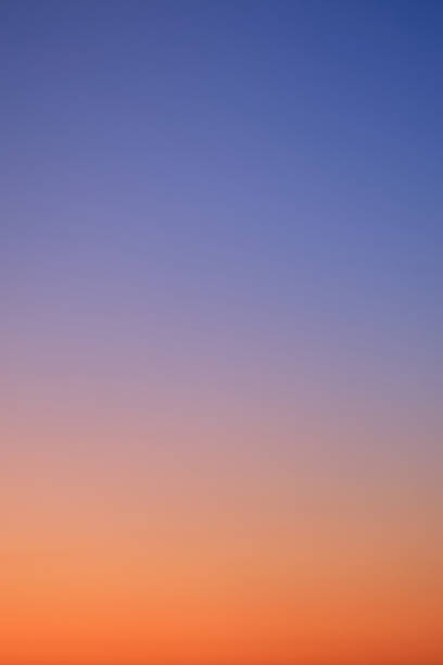 istock Gradient of sunset sky from red-orange to blue, vertical photo 1949223399