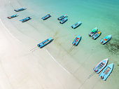 Longtail Boats on the famous fullmoon Beach Haadrin on Koh Phangan, Thailand