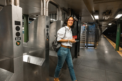 Woman entering to subway platform in New York.