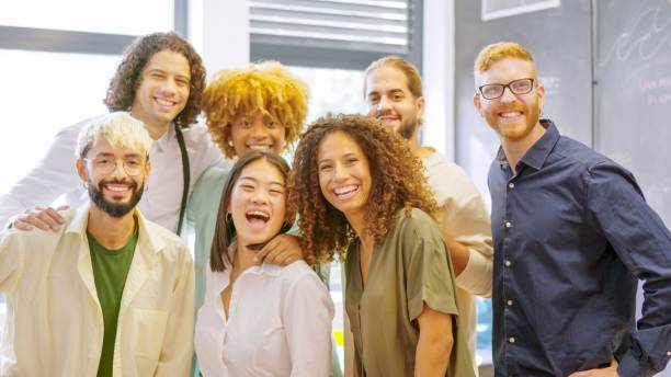 istock Group of multi-ethnic coworkers smiling at camera together 1949237223