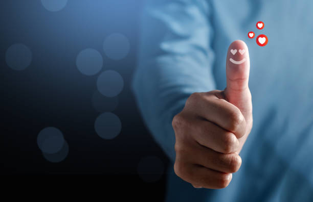 Hand giving happy smile face in comment box, user giving good feedback rating, think positive , customer review, assessment, of mental health day, Compliment Day, satisfaction concept.