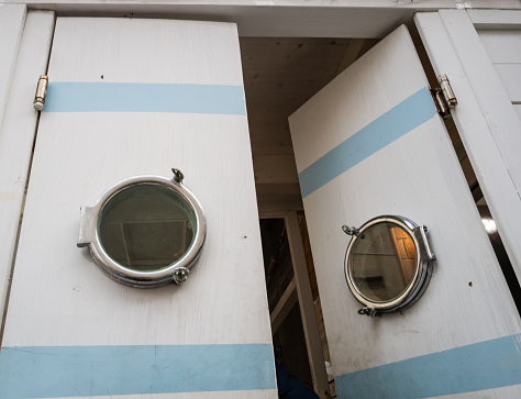 Doors with portholes on a trawler of the Mediterranean Sea