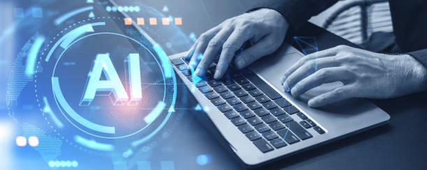 istock Top view of man hands texting in laptop, AI hologram and machine learning 1949337231