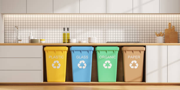 istock Home kitchen interior and colorful bins for different types of garbage 1949345618