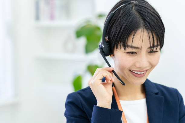 istock Japanese woman working at a call center 1949366410