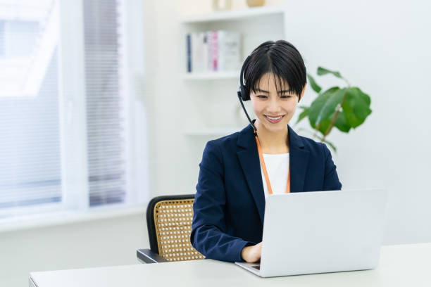 istock Japanese woman working at a call center 1949368496