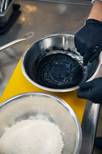 istock Chef uses cuttlefish ink for natural coloring 1949380986