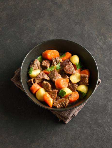 istock Beef stew with potatoes, carrots and greens 1949404406