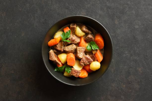 istock Beef stew with potatoes, carrots and greens 1949404409