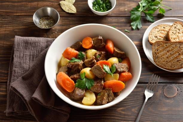 istock Beef meat stewed with potatoes, carrots and spices 1949404414