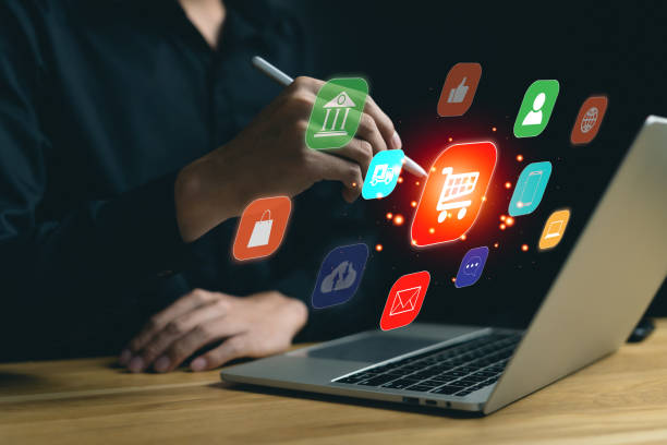 istock Online shopping on smartphone application technology. Man happy and touching on virtual app screen with computer laptop. Choose products, payment, sell products, purchase on the internet at home 1949409592