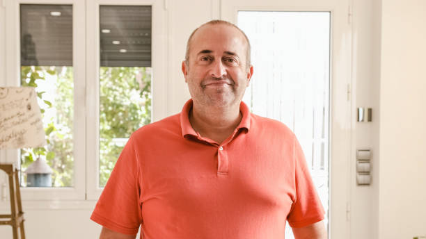 istock Happy mature man looking at the camera and talking 1949410138
