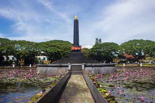 Tugu Kota Malang or Malang City Monument with a beautiful blue sky background