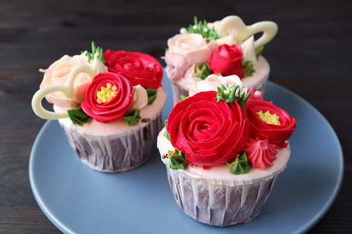 Plate of delectable gorgeous flower bouquet shaped frosting cupcakes