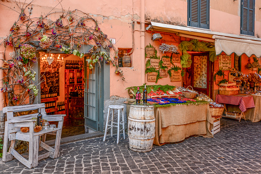 Nemi, Italy 10-04-2016 Street view in Nemi, Italy with  various store fronts selling berries and othe items.