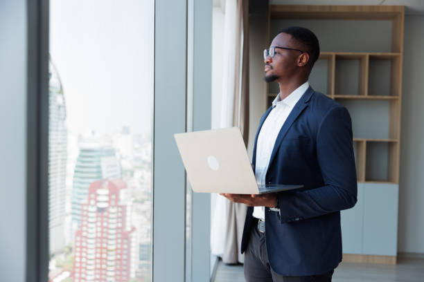 Black people Businessman using mobile laptop in the room