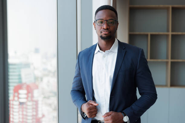 istock Black people Businessman using mobile phone in the room 1949435343