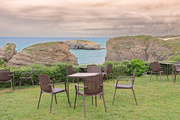 istock Tables and chairs on Las Catedrales beach in summer 1949436401