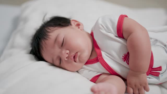 Little cute baby or fat boy in sleep. Child resting at lunch time. Care. Sleeping child.