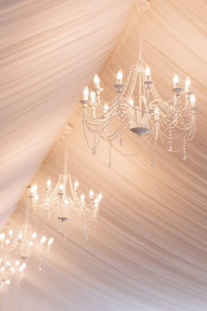 chandeliers in a white tent for a wedding or celebration. High quality photo