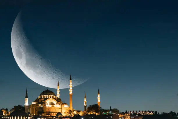 Mosque background photo. Suleymaniye Mosque and crescent moon. Ramadan or laylat al-qadr or kadir gecesi or islamic concept background photo.