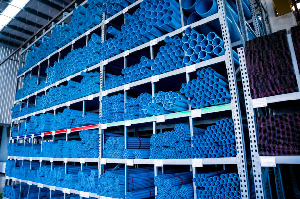 istock Blue plastic pipes in a stack in a large warehouse of a shopping center 1949512922