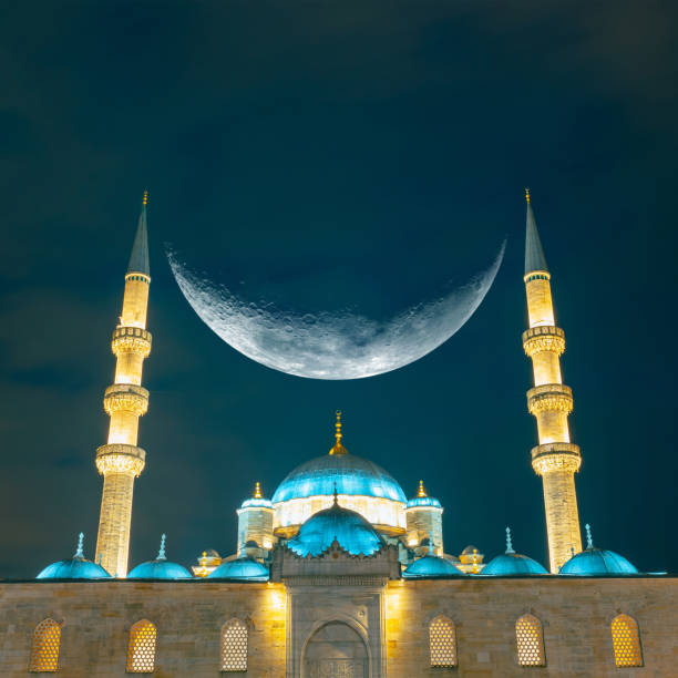 istock Eminonu New Mosque or Yeni Cami with crescent moon 1949515563