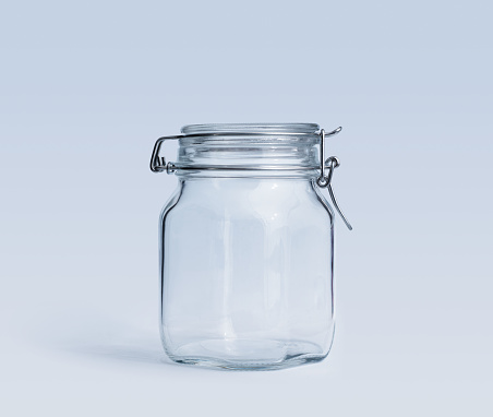 Empty clean clip-top glass jar isolated, food storage concept