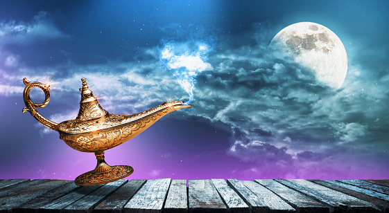 Golden magic lamp and night sky with full moon in the background