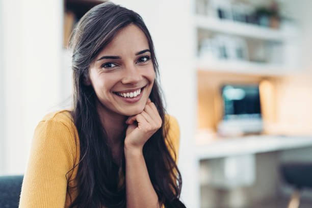 istock Smiling young woman looking at the camera 1949538745