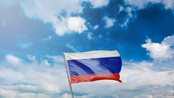 istock flag of russia on blue sky background 1949557319