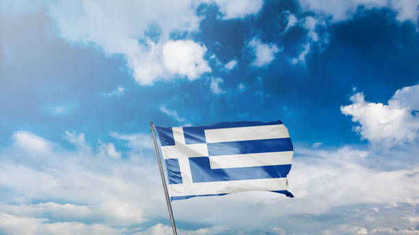 istock flag of greece on blue sky background 1949558406