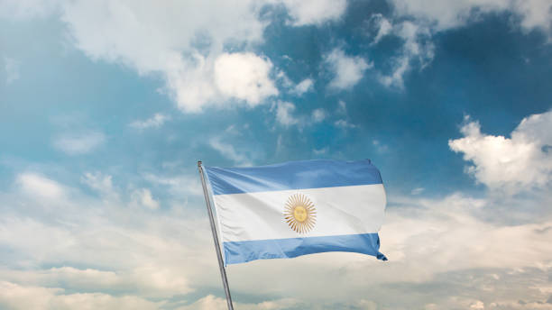 istock flag of argentina on blue sky background 1949559516