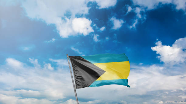 istock flag of bahamas on blue sky background 1949560620