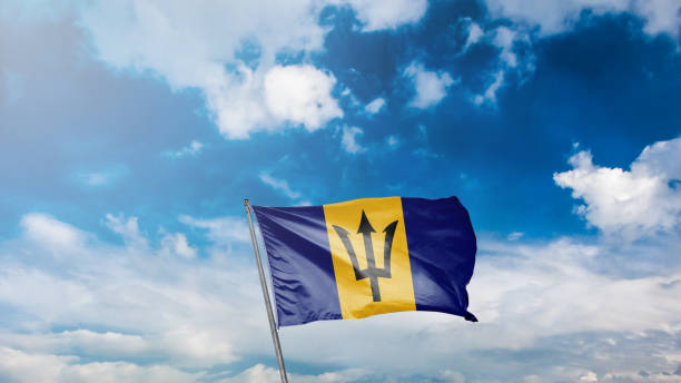 istock flag of barbados on blue sky background 1949561184